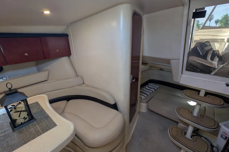 Slide: The Image of Interior of 2001 Wellcraft 3300 Martinique yacht with beige seating and wooden cabinetry. - 46