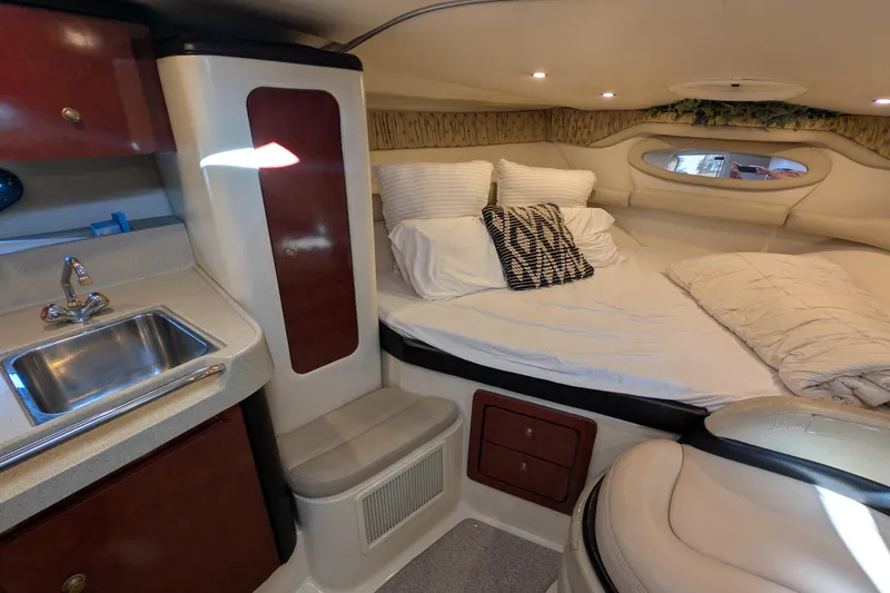 Slide: The Image of Interior of 2001 Wellcraft 3300 Martinique yacht with cozy bed and compact kitchenette. - 49