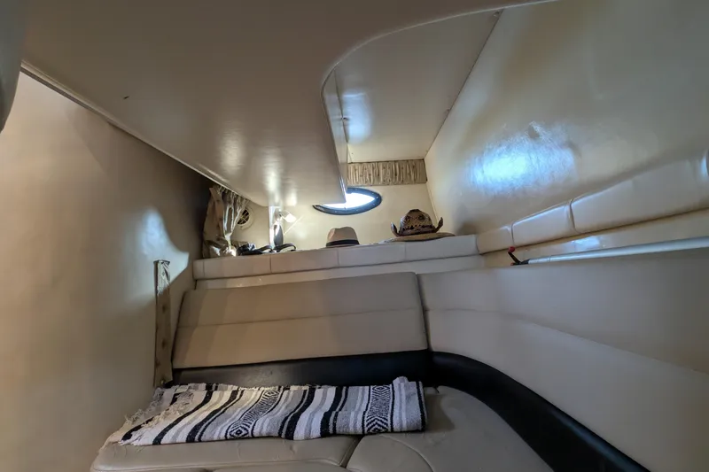 Slide: The Image of Interior cabin of 2001 Wellcraft 3300 Martinique boat with cozy seating and decor. - 52