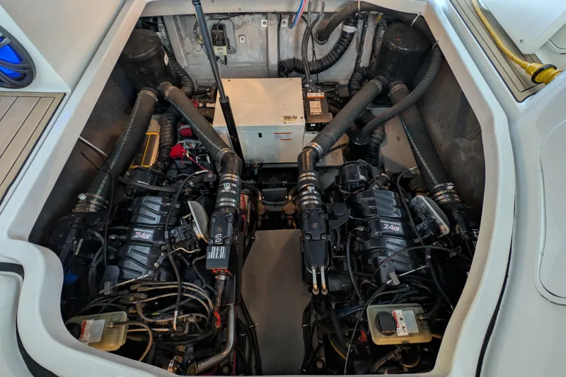 Slide: The Image of Engine compartment of a 2001 Wellcraft 3300 Martinique boat, showcasing dual engines. - 70