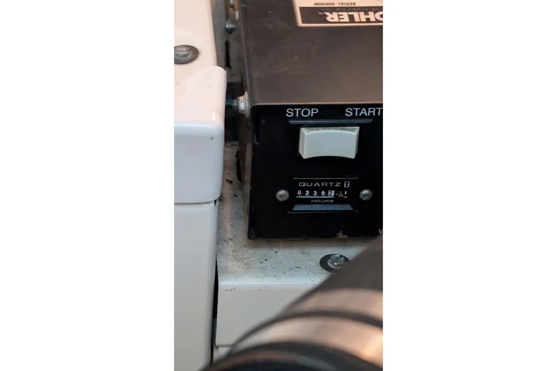 Slide: The Image of Hour meter on 2001 Wellcraft 3300 Martinique boat, displaying 2392.1 hours. - 77