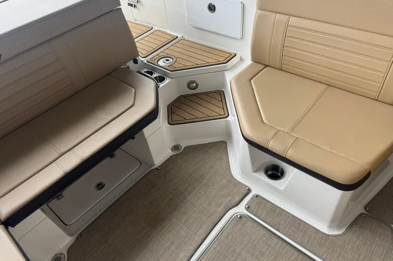 Slide: The Image of Interior seating of 2020 Sea Ray SPX 230 boat with tan upholstery. - 4