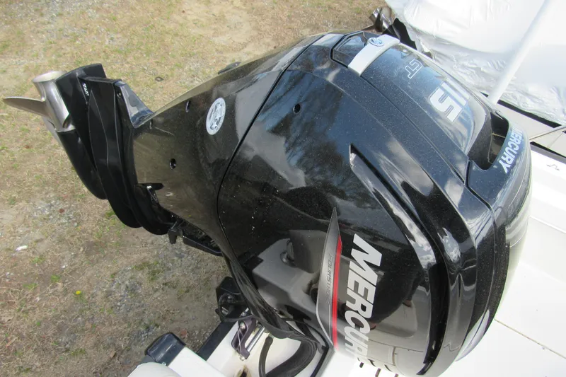 Slide: The Image of 2023 Boston Whaler 170 Montauk with Mercury outboard motor, showcasing sleek design. - 10