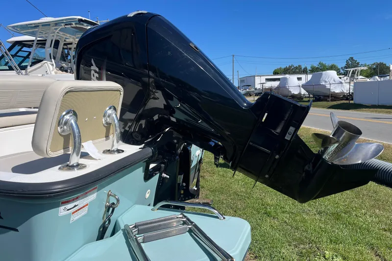 Slide: The Image of 2023 Boston Whaler 170 Montauk boat with powerful outboard motor on display. - 17