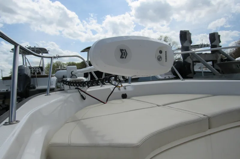 Slide: The Image of 2023 Boston Whaler 170 Montauk boat with Terrova motor, featuring cushioned seating and railing. - 4