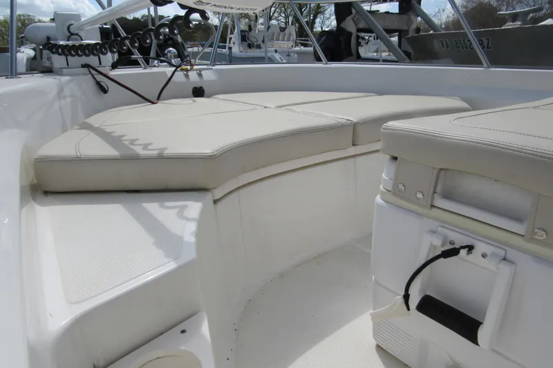 Slide: The Image of 2023 Boston Whaler 170 Montauk boat interior with cushioned seating. - 5