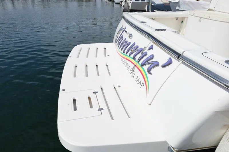 Slide: The Image of 2007 Tiara 4200 Open yacht stern with swim platform, docked in calm waters. - 11