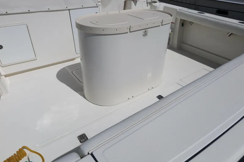 Slide: The Image of 2007 Tiara 4200 Open boat deck with storage compartment and seating area. - 12