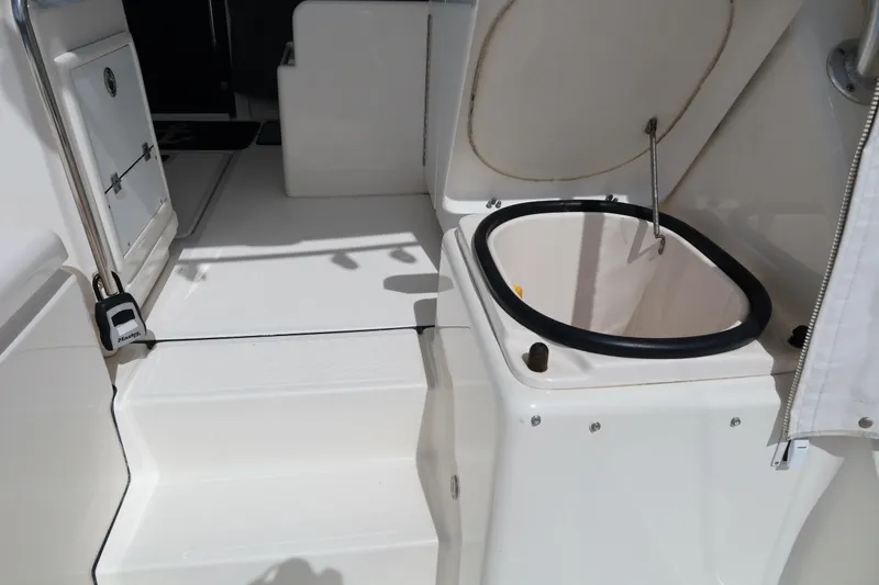 Slide: The Image of 2007 Tiara 4200 Open yacht interior with open storage compartment and steps. - 18