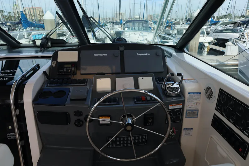 Slide: The Image of Helm of 2007 Tiara 4200 Open yacht with Raymarine navigation system, docked at marina. - 23