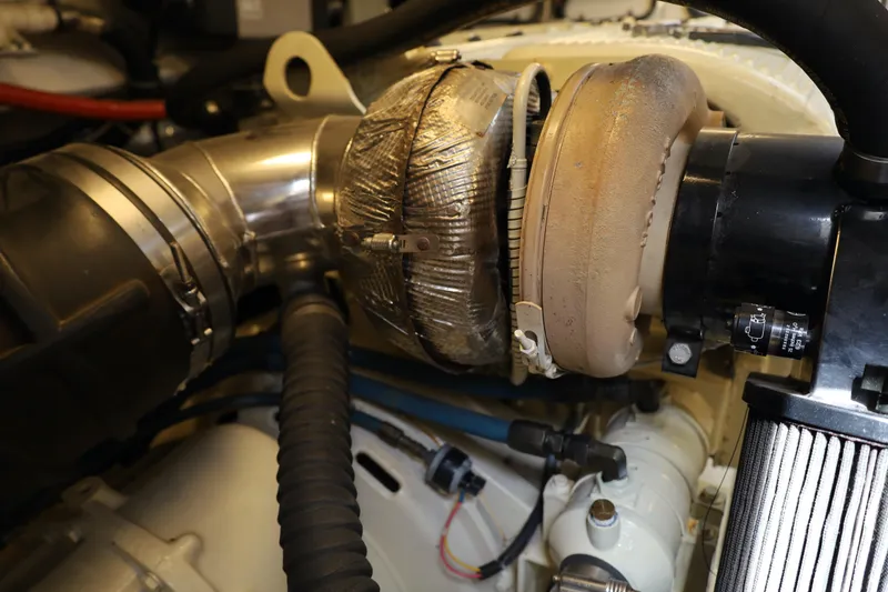 Slide: The Image of Engine compartment of a 2007 Tiara 4200 Open boat, showcasing mechanical components. - 24