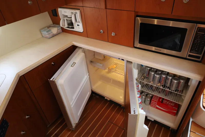 Slide: The Image of 2007 Tiara 4200 Open yacht kitchen with fridge, microwave, and coffee maker. - 27