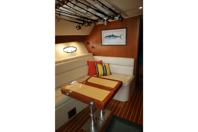 Slide: The Image of Interior of 2007 Tiara 4200 Open yacht with seating, table, and fishing rods. - 28