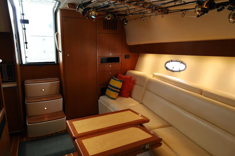 Slide: The Image of Luxurious interior of a 2007 Tiara 4200 Open yacht with plush seating and fishing rods. - 29