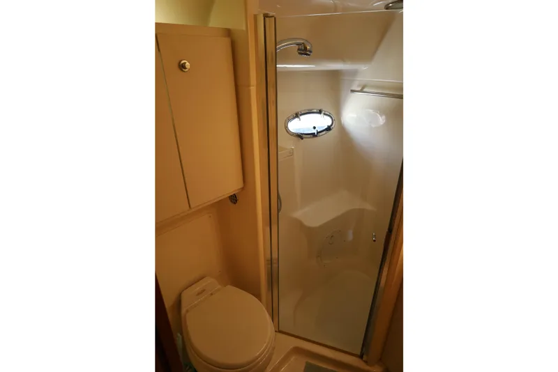 Slide: The Image of Bathroom interior of 2007 Tiara 4200 Open yacht, featuring shower and toilet. - 31