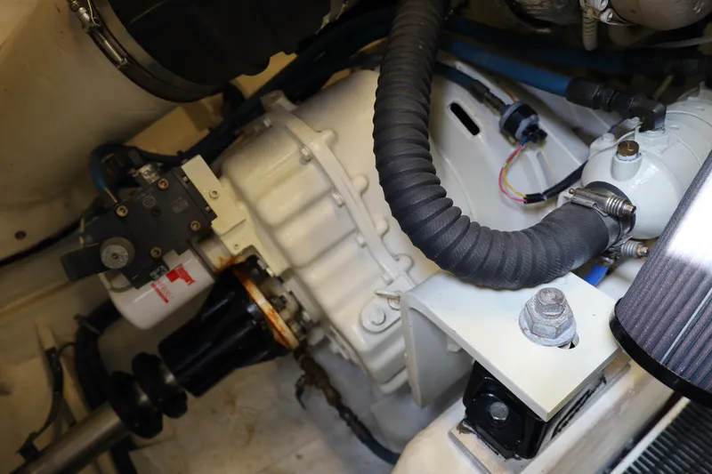 Slide: The Image of Engine compartment of a 2005 Tiara Yachts 4200 Open, showcasing mechanical components and wiring. - 36