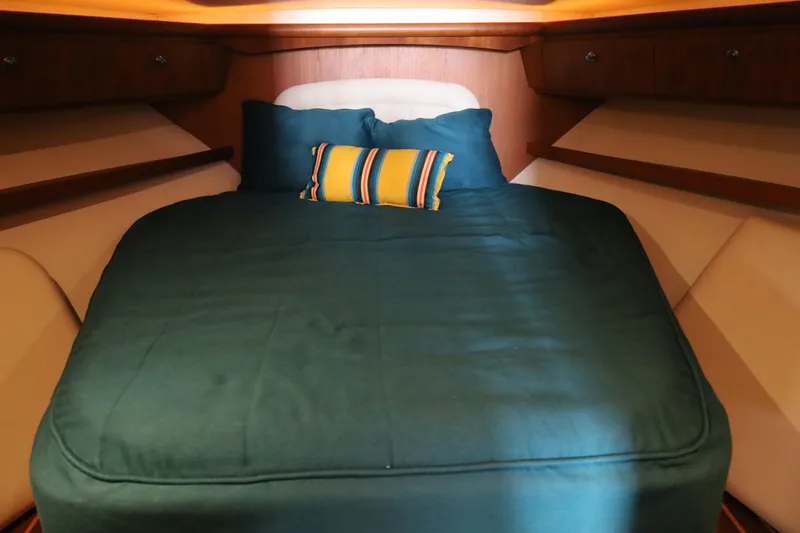 Slide: The Image of Cozy cabin interior of 2005 Tiara Yachts 4200 Open with plush bedding. - 40