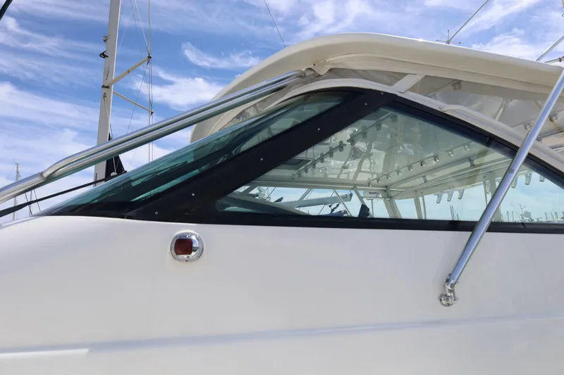 Slide: The Image of 2007 Tiara 4200 Open yacht, sleek design with clear windows and stainless steel railings. - 6