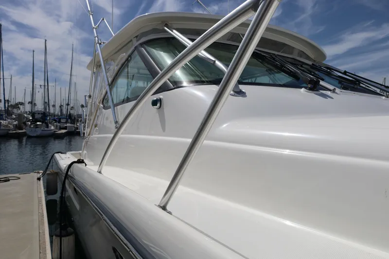 Slide: The Image of 2007 Tiara 4200 Open yacht docked at marina under blue sky. - 7