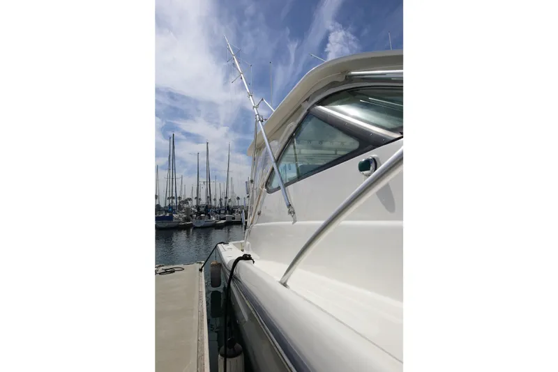 Slide: The Image of 2007 Tiara 4200 Open yacht docked at marina under blue sky. - 8