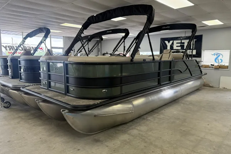 Slide: The Image of 2026 Bentley Pontoons Legacy 243 Swingback in showroom, featuring sleek design and modern amenities. - 1