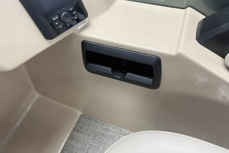 Slide: The Image of Control panel of 2026 Bentley Pontoons Legacy 243 Swingback with beige interior. - 11