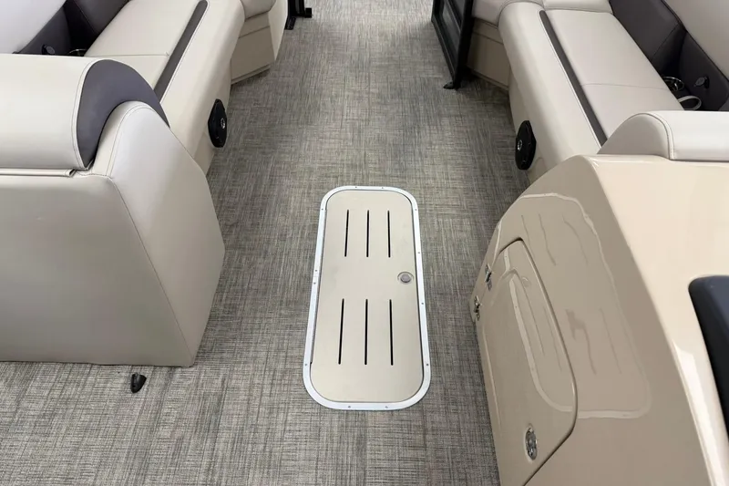 Slide: The Image of Interior of 2026 Bentley Pontoons Legacy 243 Swingback with beige seating and flooring. - 12