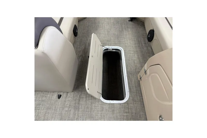 Slide: The Image of 2026 Bentley Pontoons Legacy 243 Swingback interior storage compartment open on deck. - 13
