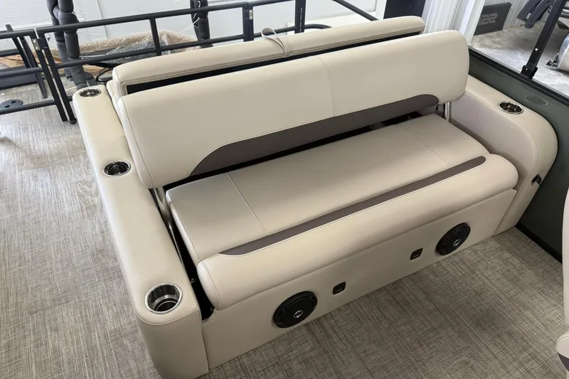 Slide: The Image of 2026 Bentley Pontoons Legacy 243 Swingback interior seating with cup holders and speakers. - 4