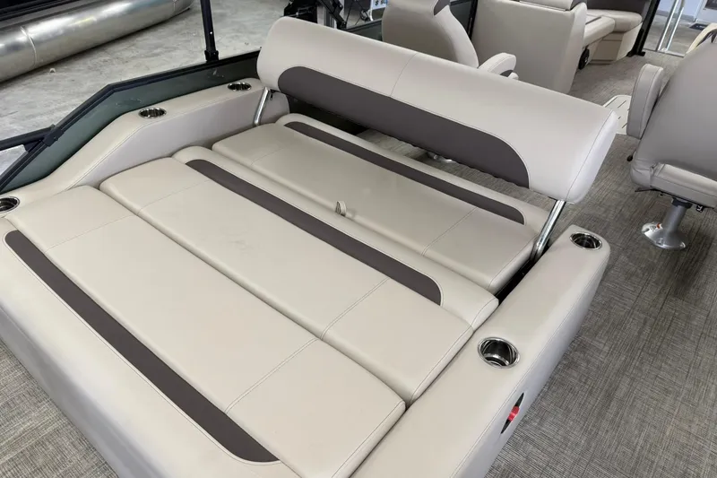 Slide: The Image of 2026 Bentley Pontoons Legacy 243 Swingback interior seating, featuring luxurious beige upholstery. - 5