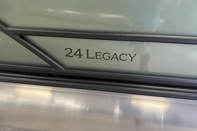 Slide: The Image of 2026 Bentley Pontoons Legacy 243 Swingback, close-up of '24 Legacy' branding detail. - 6