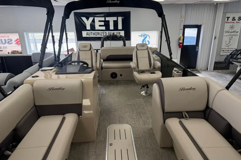 Slide: The Image of 2026 Bentley Pontoons Legacy 243 Swingback interior with beige seating and modern design. - 7