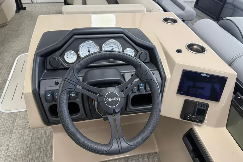 Slide: The Image of 2026 Bentley Pontoons Legacy 243 Swingback dashboard with steering wheel and gauges. - 9