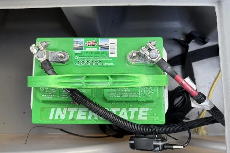 Slide: The Image of Interstate marine battery in a 2023 Bennington 22SSR boat compartment. - 26