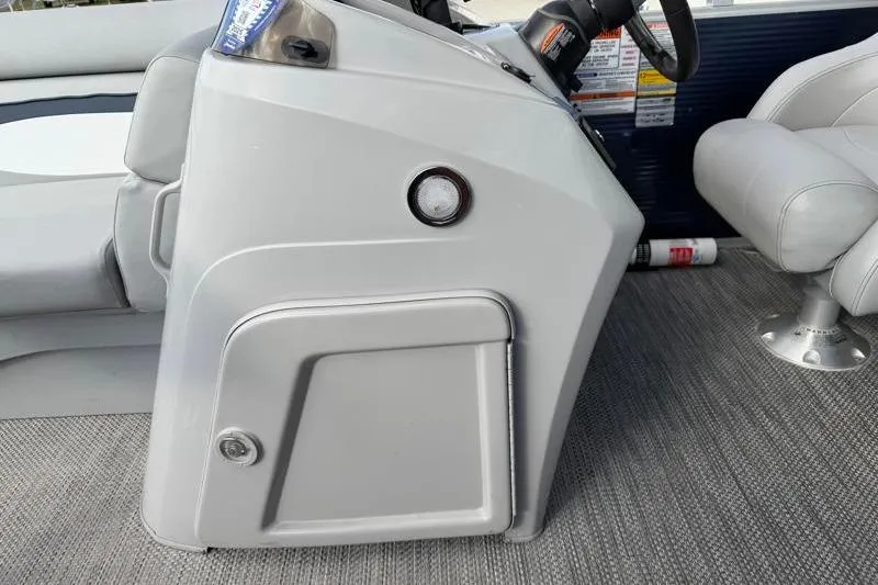 Slide: The Image of 2023 Bennington 22SSR boat interior with steering console and seating. - 28