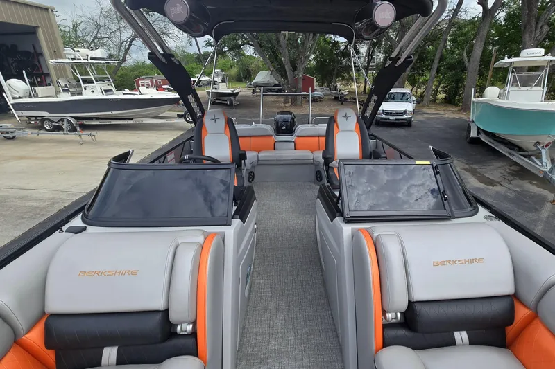 Slide: The Image of Interior of a 2021 Berkshire 25 Sport CL DC 3.0+ pontoon boat, featuring sleek seating. - 11