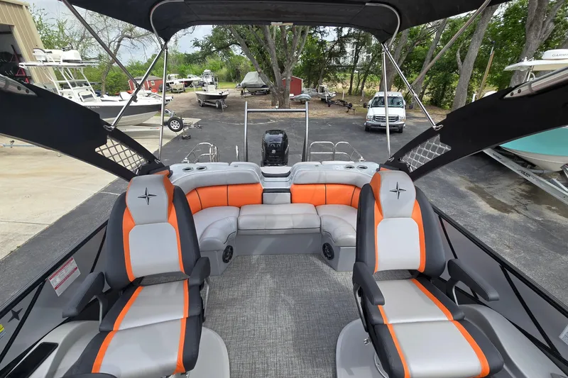 Slide: The Image of 2021 Berkshire 25 Sport CL DC 3.0+ pontoon boat interior with orange and gray seating. - 12