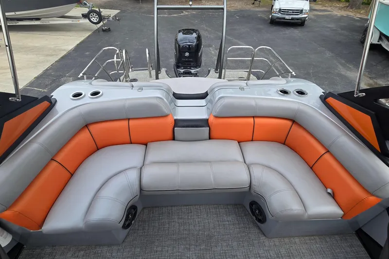 Slide: The Image of Interior of 2021 Berkshire 25 Sport CL DC 3.0+ pontoon boat with orange and gray seating. - 13