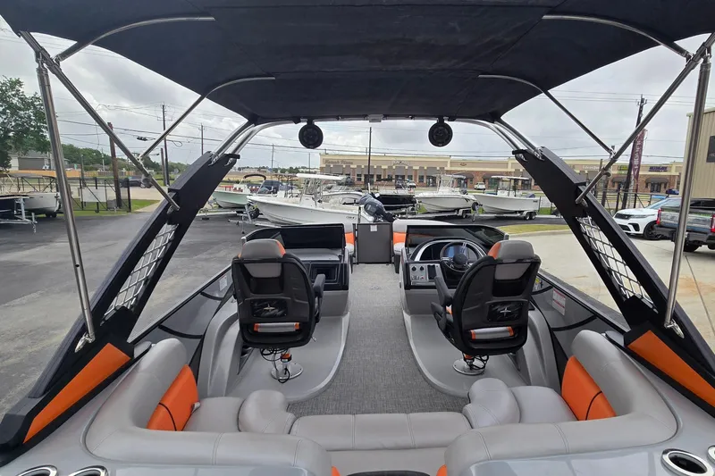 Slide: The Image of Interior view of a 2021 Berkshire 25 Sport CL DC 3.0+ pontoon boat, showcasing seating and helm. - 17