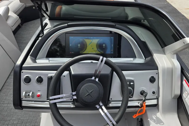 Slide: The Image of Steering console of 2021 Berkshire 25 Sport CL DC 3.0+ with digital display and controls. - 20