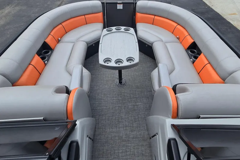 Slide: The Image of 2021 Berkshire 25 Sport CL DC 3.0+ pontoon boat interior with gray and orange seating. - 21