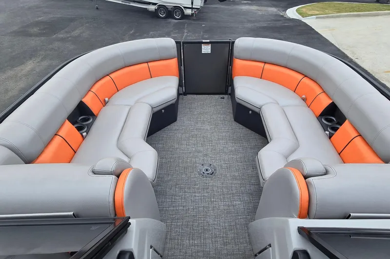 Slide: The Image of Interior of 2021 Berkshire 25 Sport CL DC 3.0+ pontoon boat with orange and gray seating. - 22