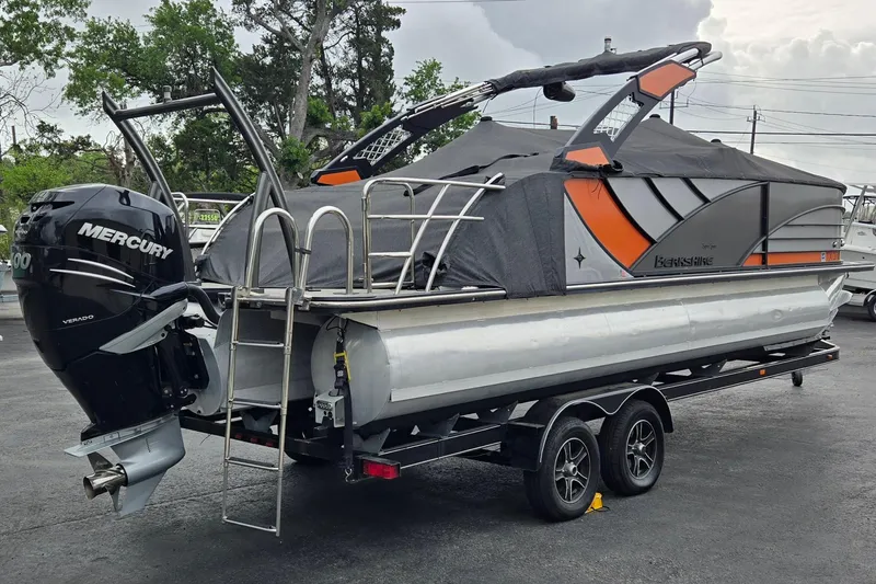 Slide: The Image of 2021 Berkshire 25 Sport CL DC 3.0+ pontoon boat with Mercury engine on trailer. - 25