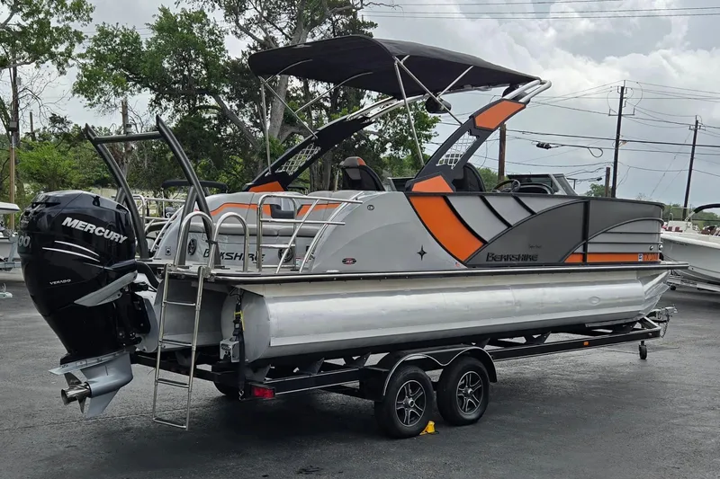 Slide: The Image of 2021 Berkshire 25 Sport CL DC 3.0+ pontoon boat with Mercury engine on trailer. - 3
