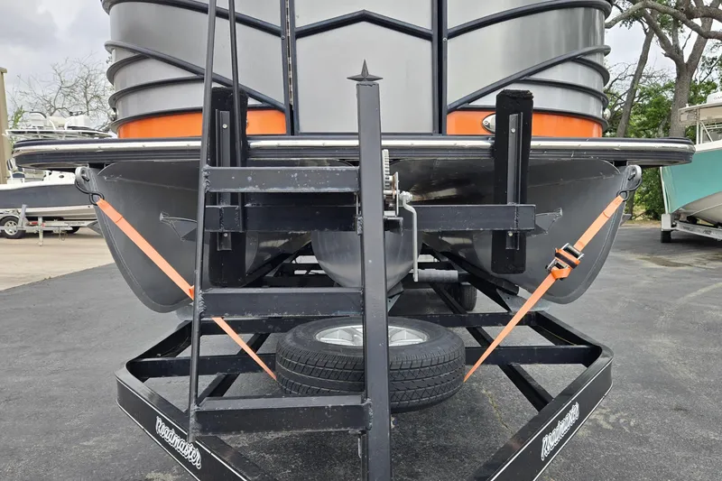 Slide: The Image of 2021 Berkshire 25 Sport CL DC 3.0+ pontoon boat on trailer, secured with straps. - 31