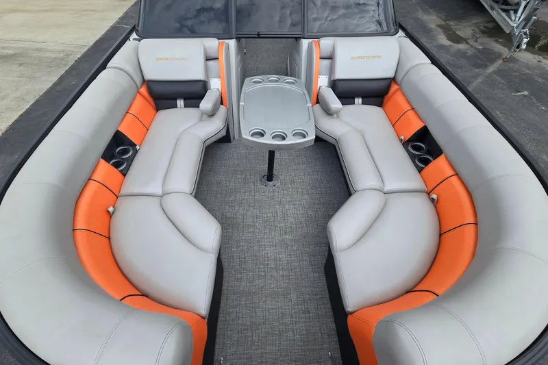 Slide: The Image of Interior of a 2021 Berkshire 25 Sport CL DC 3.0+ pontoon boat with orange and gray seating. - 9
