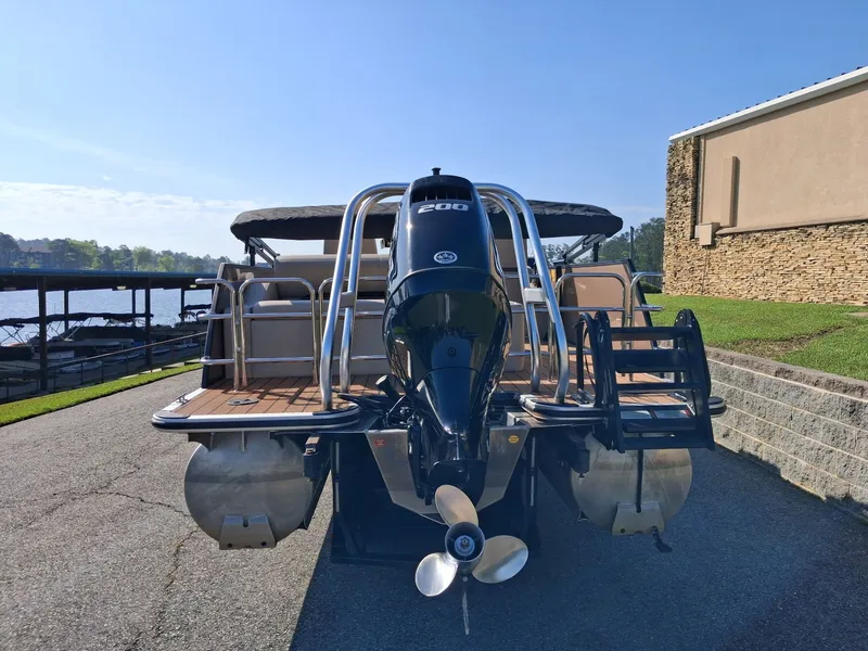 Slide: The Image of 2025 Bentley Pontoons Legacy 223 Swingback by the water. - 4