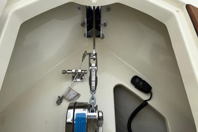 Slide: The Image of 2023 Chris-Craft Calypso 28 anchor system with chain and winch in boat compartment. - 23