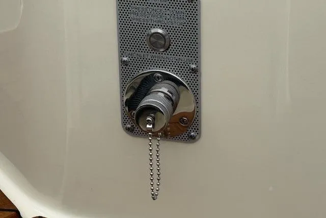 Slide: The Image of Fuel inlet on 2023 Chris-Craft Calypso 28 boat with safety chain. - 7