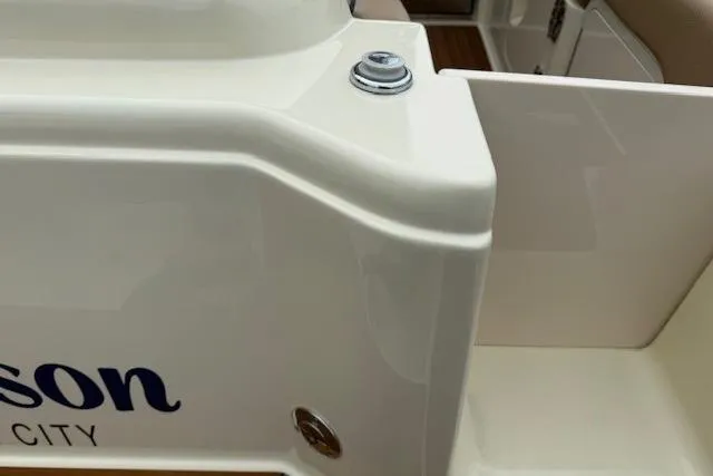 Slide: The Image of 2023 Chris-Craft Calypso 28 boat detail, showcasing sleek white finish and hardware. - 8